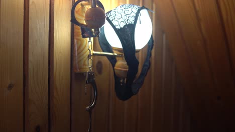 handcuffs-and-underwear-on-the-lamp